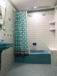 These small rooms—especially powder rooms and half baths—can inspire so much creativity and whimsy, mostly because they feel a bit separate from the rest of the house. Monica S Retro Bathroom Remodel Built Around A Blue Crane Oxford Tub Sink And Toilet Bathrooms Remodel Retro Bathrooms Blue Bathtub