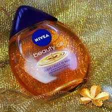 choose gold and nothing less the nivea beauty oil bath spoils your skin with nurturing ingredients beauty oil beauty skin care routine skin care hair care