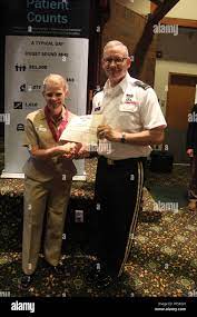 Brig. Gen. Dennis P. LeMaster, Commanding General, Regional Health  Command-Pacific, inducts Capt. Christine Sears into military medicine's  prestigious Order of the Military Medical Merit at Joint Base Lewis-McChord  Washington Stock Photo -