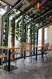 Cafe Seating With Vertical And Hanging Garden Cafe Seating Hospitality Design Exterior Design