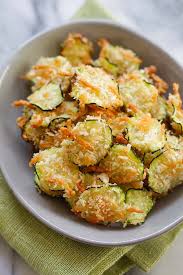 Calories per serving of zucchini parmesan crisps 32 calories of olive oil, extra virgin, (0.25 tbs) 27 calories of parmesan cheese, grated, (0.06 cup) 26 calories of bread crumbs, dry, grated, plain, (0.06 cup) Parmesan Zucchini Chips Crispy Zucchini Chips Coated With Parmesan Cheese And Bread Crumbs So Healthy And Recipes Parmesan Zucchini Chips Vegetarian Recipes