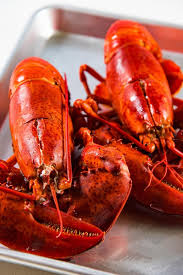 This article provides instructions on how to cook boiled whole lobster and broiled or grilled lobster tails. Two Cooked Lobsters On A Baking Tray How To Cook Lobster Lobster Recipes Tail Cooking