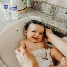 In addition to supporting your child, it will also prevent her from lying down in the water and moving about freely, which may help her feel more secure until she's ready and used to bathing in the big tub. How To Bathe A Newborn 10 Simple Steps Mustela Usa