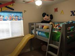A loft bed with a desk is welcome addition to a kids' or guest room. Builders Showcase Loft Bed With A Slide The Design Confidential