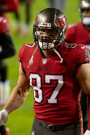 Hold the case, with your airpods inside and the lid open, next to your ios device. Rob Gronkowski Wikipedia