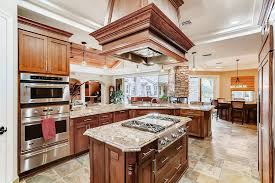 Extras, including granite counters, a refrigerator, and led lighting, are ordered a la carte. The Kitchen Features A Large Center Island With Granite Countertop And Gas Cooktop Berkshire Las Vegas Review Journal