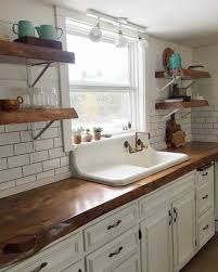 White Farmhouse Kitchen With Floating Shelves By Theupcyclingjunkies Farmhouse Kitchen Decor White Kitchen Decor Kitchen Shelf Decor