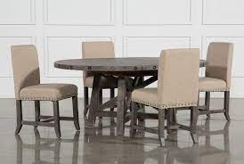 A table that belongs on a pedestal—literally! Jaxon Grey 5 Piece Round Extension Dining Set With Upholstered Chairs Round Dining Room Sets Living Spaces Dining Tables Round Dining Room