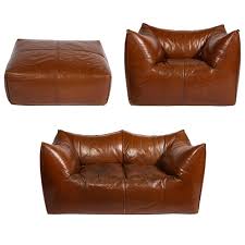 It may be the most versatile furniture piece available anywhere. Mario Bellini Cognac Brown Leather Sofa Chair Ottoman Le Bambole Set Italy At 1stdibs