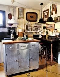 Choose a wood or butcher block top to make preparing food a chinch, and all of the kitchen islands feature handsome finishes like black, white, oak and mahogany. 10 Best Reclaimed Metal Cabinets Ideas Metal Kitchen Cabinets Kitchen Remodel Retro Kitchen