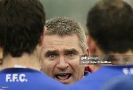 Peter Rohde coach of the Bulldogs addresses his team at the break... News  Photo