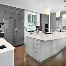 Three Colors Of Cabinetry And Mixed Blue Backsplashes Create A Unique Kitchen By Cucina Bella Modern Grey Kitchen Kitchen Design Centre Grey Kitchen Cabinets