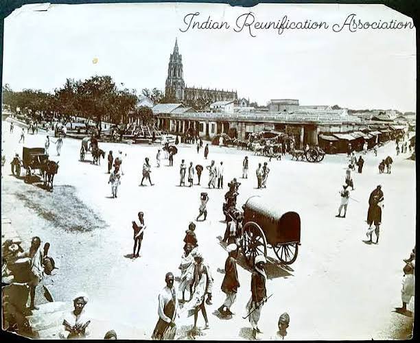 An old photographic image of an English 'memsahib' with some Indian ladies, British India, circa late 19th century. Can anyone please identify the location more precisely? Somebody told me it could be