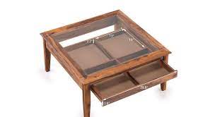 The suitcase coffee table is a cool addition that fits in surprisingly well with a wide variety styles and the suitcase coffee table is often an addition that comes about because you have an old trunk or. Urban Ladder Tate Display Coffee Table Finish Teak Amazon In