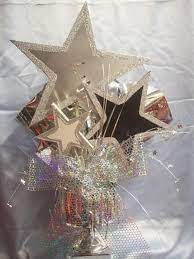 Vælg mellem et stort udvalg af lignende scener. Triple Star Centerpiece Oh How Cute Online Store Star Centerpieces Star Decorations Hollywood Party Theme