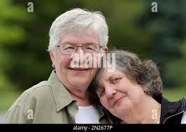 Marjorie McCann, left, and her wife, Carole Smith, pose for a photograph in  Kennett Square, Pa.