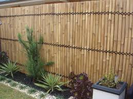 An inspirational perimeter or privacy fence around your garden keeps out unwanted guests but it also adds structure and beauty to your landscaping. Bamboo Fence Panels Privacy Fence Ideas Bamboo Poles Fence Garden Decor Ideas Bamboo Garden Fences Bamboo Garden Bamboo Screening Fence