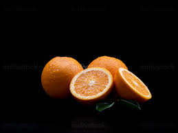 Golden orange floral texture seamless pattern background. Healthy Food Fresh Oranges Fruit On The Black Background Indivstock