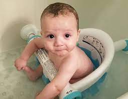 The kitchen sink is easy to use because it is the right height. Bath Time Essentials For Your 6 Month Old Baby Bath Time Baby Month By Month Six Month Old Baby