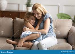 Little Daughter and Young Mommy Hugging on Couch Stock Image - Image of  adult, female: 197376281
