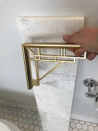 Make sure to get the height right to keep your shelving out of the way — you don't want anyone easily convert a floating wall shelf into a charging station by hanging it above an outlet with brackets. How High Should I Hang Shelves Above My Toilet