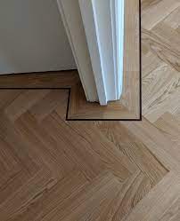 Oak Parquet Wooden Floor Fitted In A Herringbone Design With A Single Border Wenge Tramline And Mitred Herringbone Wood Floor Engineered Wood Floors Flooring