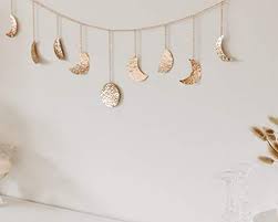 Amazon Com Moon And Gaia Moon Phase Wall Hanging Rose Gold Unique Lightweight Moon Phase Garl In 2020 Gold Wall Decor Bedroom Gold Room Decor Rose Gold Room Decor