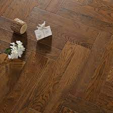 The dark gray grout enhances the pattern with a pop of dark color. China European Oak Engineered Wood Flooring 450 5 12 1 2mm Parquet Herringbone Dark Wood Floor China Pvc Flooring Spc Flooring