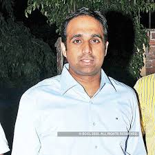 Shooter Hyder Khan strikes a pose for the cameras during a dinner bash to  celebrate the conclusion of the All India Rifle Shooting Competition,  hosted at his residence in Hyderabad