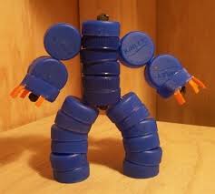 Setelah siap, kancing ditempel mengikuti pola gambaran. Kreasi Unik Mainan Anak Robot Robotan Dari Tutup Botol Bekas