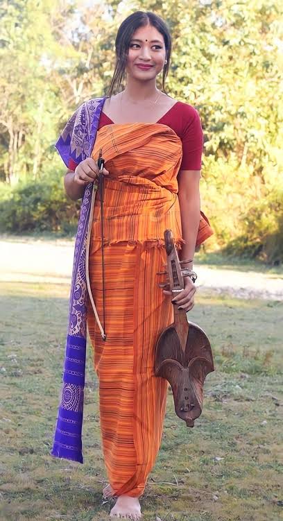 Boro girl with traditional instrument 'serja'