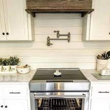 For this tutorial the stove has a custom surround made of stone. With One Of Our Pot Fillers Over The Kitchen Stove And Aesthetic Placement Of Greenery And Useful Tableware T Pot Filler Kitchen Kitchen Decor Kitchen Design