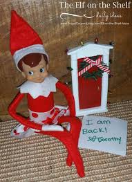 A white wooden element of furniture with. Elf On The Shelf Ideas Elf Is Back Through A Secret Elf Door