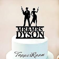 This wedding cake for kristin chirico & brian hubble took us back to the roaring 20's with it's unique art deco and great gatsby inspired design. Bonnie And Clyde Wedding Cake Topper Wedding Cake Topper Gatsby Cake Topper Gatsby Wedding Cake Topper Mobsters Or Shooters Cake Topper 1261 Amazon De Kuche Haushalt