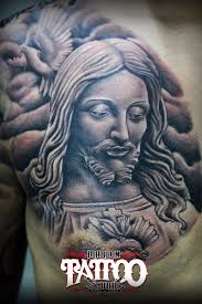 TATTOO DESCRIPTION: JESUS CHRIST...