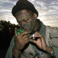 US Air Force (USAF) STAFF Sergeant (SSGT) Christopher Richards used  branches from a mesquite tree as camouflage, during the evasive movements  portion of the Aircrew Life Support Instructor Course at Dyess AFB,
