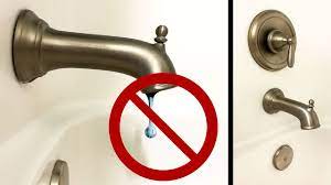 Using snap ring pliers, remove retaining ring from valve body. How To Repair A Leaky Moen Tub Shower In 30 Minutes Youtube