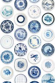 whoa porcelain wallpaper blue from studioditte must get behang muur met borden blauw servies
