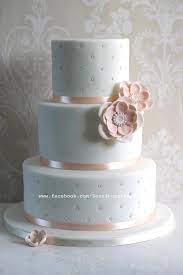 Elegant white wedding cake by joy thigpen shot by ali harper via once wed silver metallic wedding cake via brides White And Peach Wedding Cake Cake By Zoe S Fancy Cakes Cakesdecor