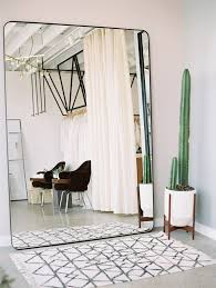 13 Tips For Decorating A Small Bedroom Hunker Try Filling An Entire Wall With A Wardrobe Mirror It Both Serves A Purpo Minimalist Bedroom Home Home Decor