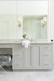 The center of each bulb should be at eye level or approximately 66 inches from the floor. 9 Tips To Design A Beautiful Functional Master Bathroom Caroline On Design Master Bathroom Layout Bathroom Sconces Modern Bathroom Vanity