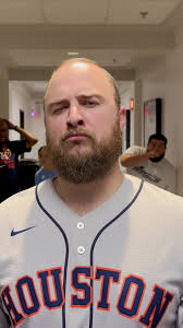 Fan Wearing Astros Jersey at Rangers Parade