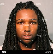 This undated photo provided by the Chicago Police Department shows Eric  Adams. Adams and Michael Washington have been charged with with  first-degree murder in the Chicago shooting death of a woman who