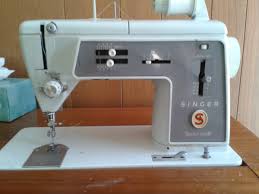 The machine comes installed in a wood cabinet with hinged leaves that fold open to expand the work surface. Vintage Singer 600 Sewing Machine In Wood Desk Cabinet Collectors Weekly