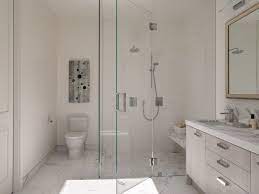 Contemporary Bathroom Features Seamless Glass Shower Accented With White Marble Bench And White Marble Shower F Green Bathroom Timeless Bathroom Sleek Bathroom