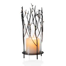 Wrought iron candle holders have been used as decor pieces for ages and have never gone out of style. Elegan Black Table Top Metal Glass Hurricane Candle Holder