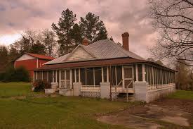 Horizontal, black and white photograph of a three story brick residence with hip roof and dormer window. Scotland Ga Telfair County Hip Roof Vernacular House Half Wraparound Screened Porch Photograph Copyright Brian Brown Vanishing South Georgia Usa 2015 Vanishing South Georgia Photographs By Brian Brown