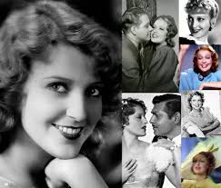 Jeanette MacDonald** in a publicity shot for the operetta NAUGHTY MARIETTA  (1935). Costume designed by **Adrian**. Her shoes are French heels. Both  MacDonald the singer-actress and Adrian the designer were born in