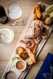 Photo New On The Menu At Rick Stein S Fish A Sharing Board Of Seared Yellowfin Tuna With Guacamole Thai Fish Cakes Salt And Thai Fish Cakes Food Fish Cake