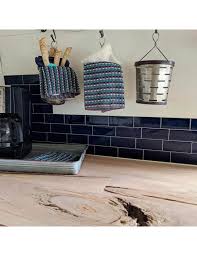A single sheet of glass, painted blue on the back, gives this kitchen a clean and contemporary look. Peel And Stick Navy Blue Subway Tile Backsplash Clever Mosaics